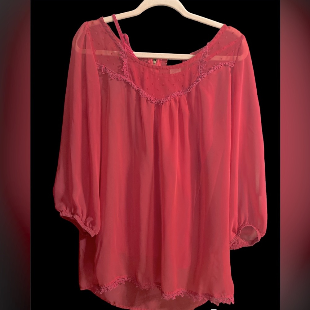 Sheer red blouse with matching red tank top underneath